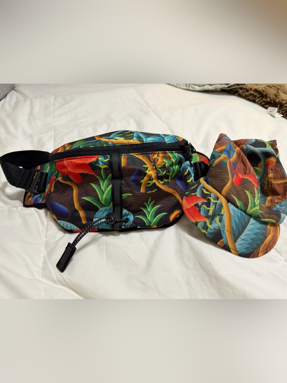 The Janji Multipass Sling Bag and matching AFO Hyperlight Cap
